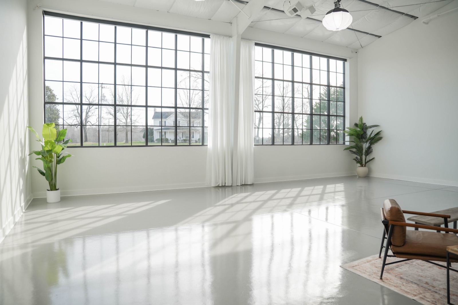 Open floor bathed in daylight at the Flagship studio